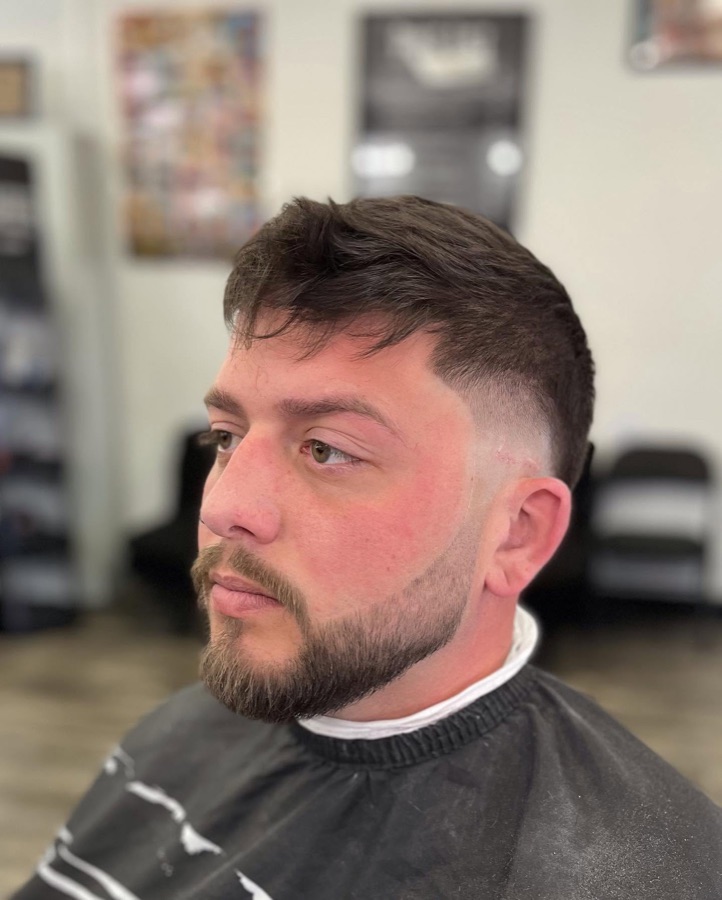 Full beard sculpted with a fade, front view, La Barberia