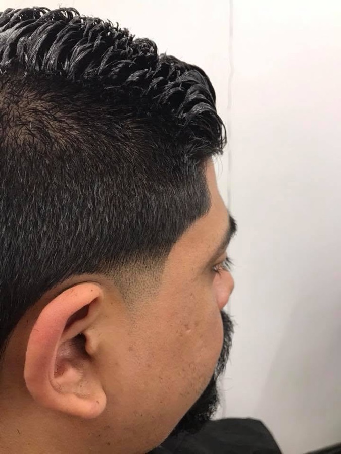 High skin fade tapered clean at the back of the head, La Barberia