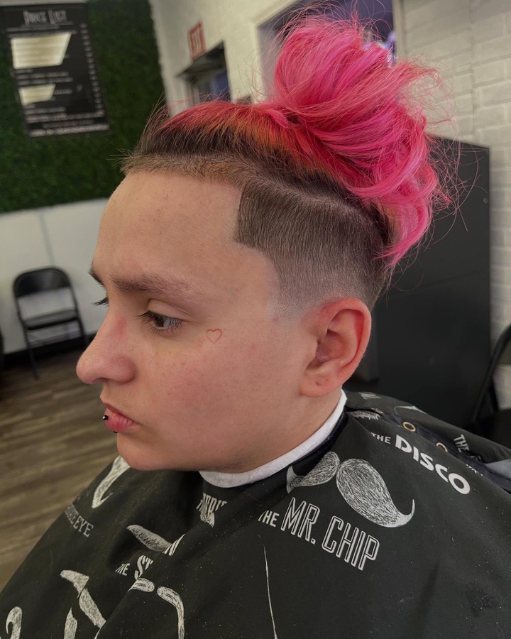 Pink-dyed mohawk paired with a skin fade, La Barberia