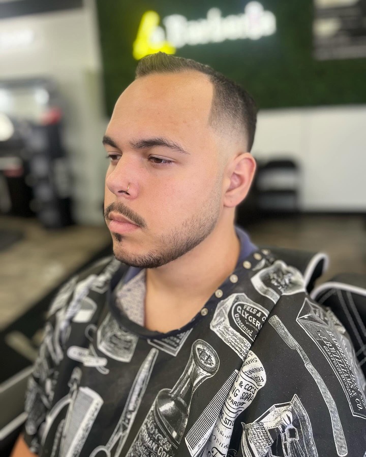 Textured brown crop over a clean fade, back view, La Barberia