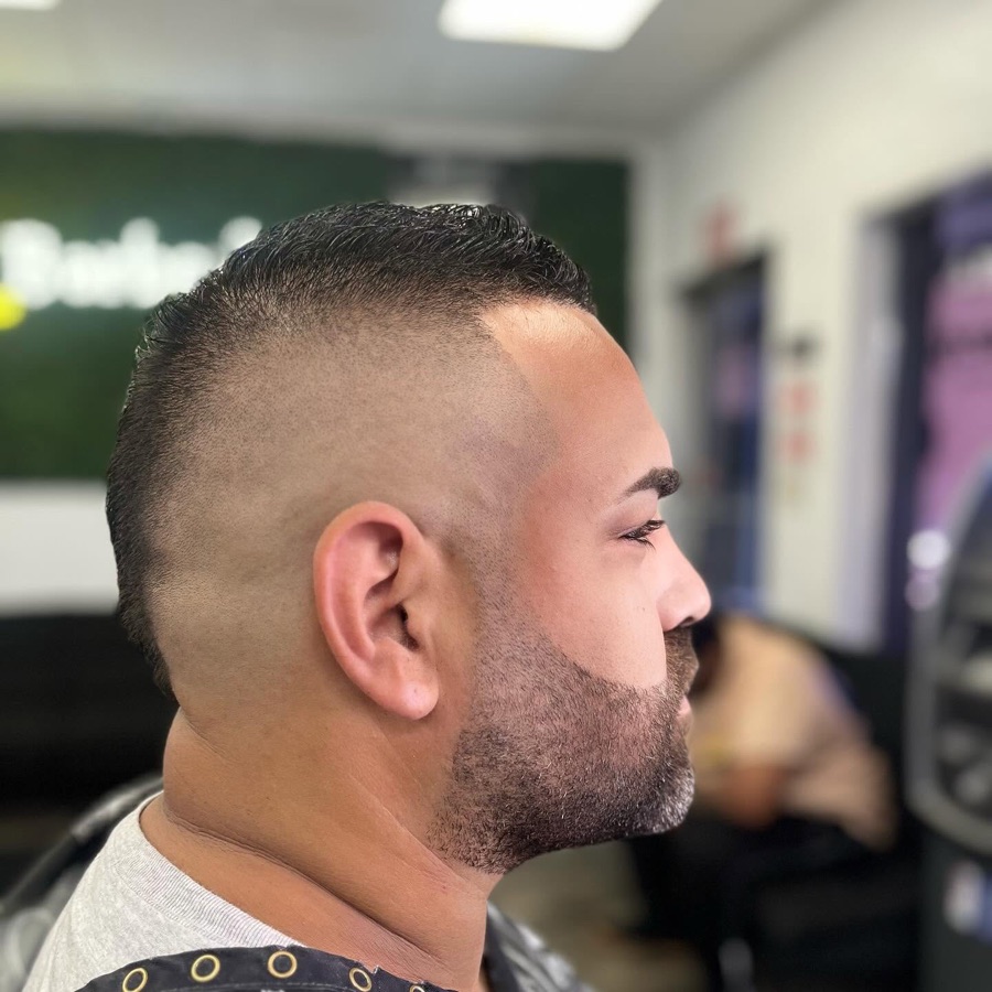 Curly top with a tight skin fade, La Barberia