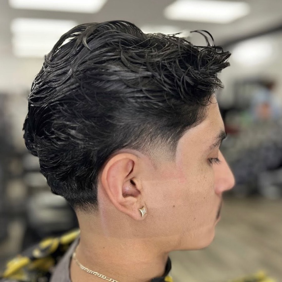 Dark textured quiff with a side fade, La Barberia