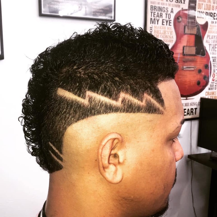 Shaved side hair design cut into a fade, La Barberia