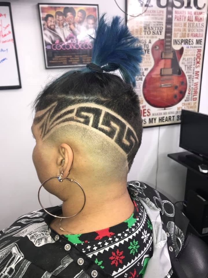 Intricate shaved hair design across the back of the head, La Barberia