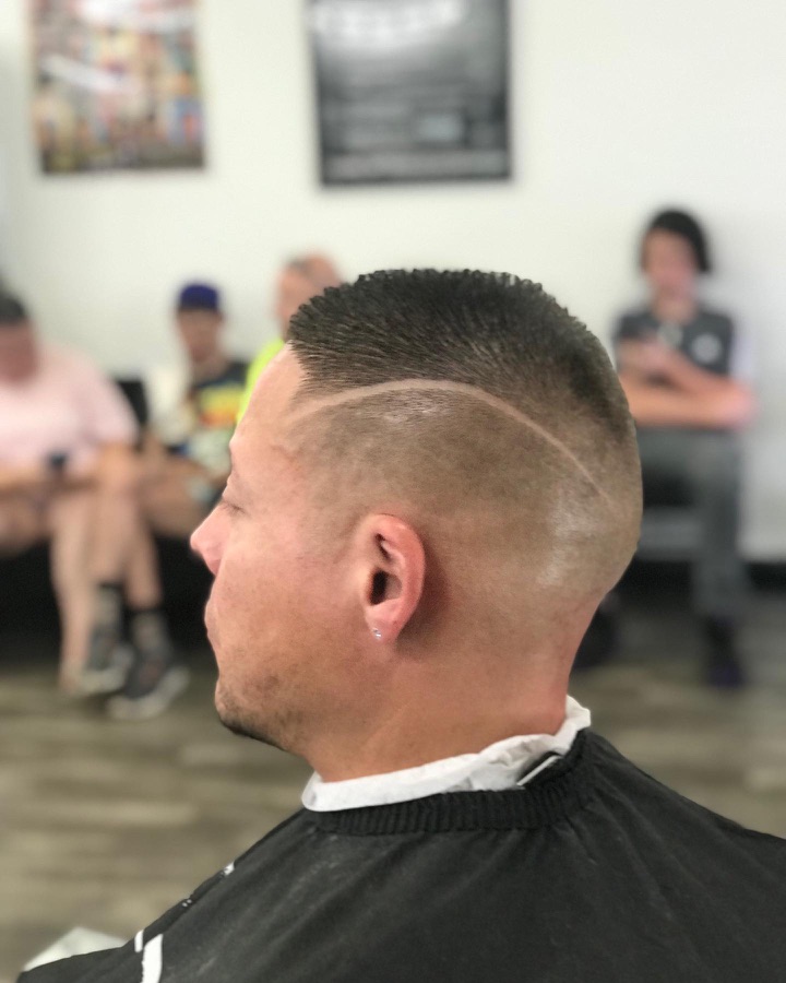 Geometric shaved hair design at the back of the head, La Barberia