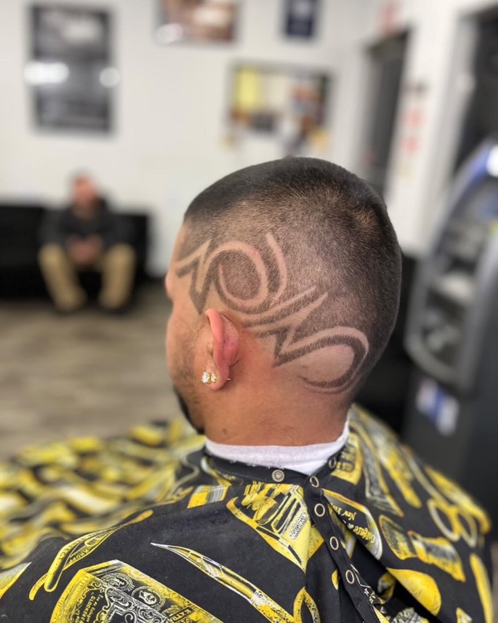 Geometric key-pattern hair design shaved into the side, La Barberia
