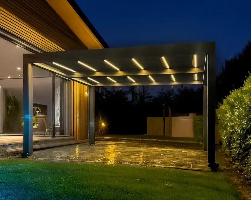 Sunspace louvered pergola with LED lighting in the blades at night