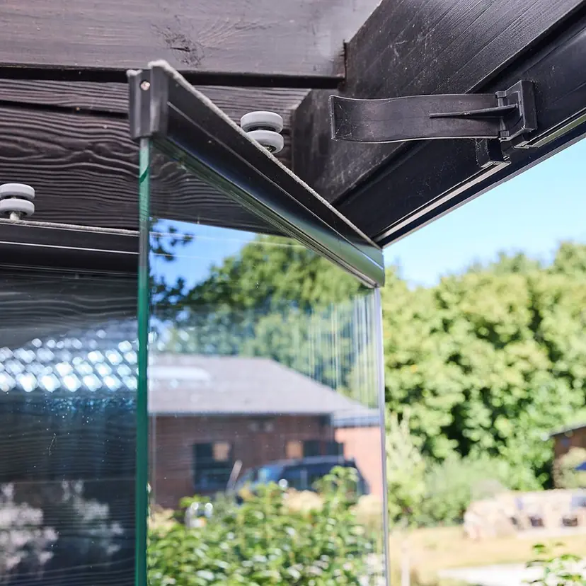 NovaSun Panoramic glass panel pivoted open on a terrace
