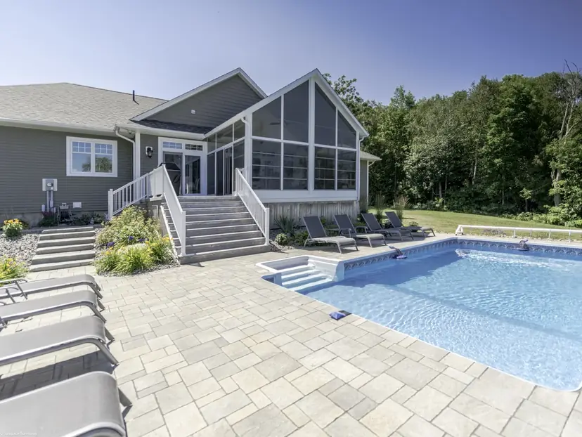 Enclosed Sunspace porch above a pool deck