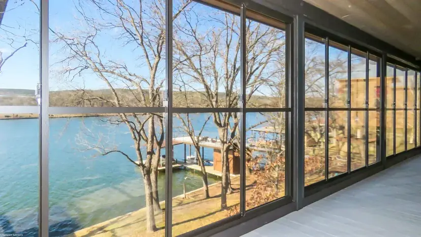 Sunspace WeatherMaster enclosed room looking out on a lake